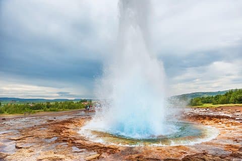 Strokkur erupting quite a show, make sure to stay upwind