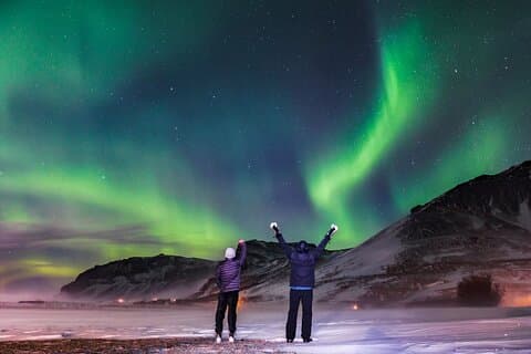 Guests chasing the Northern Lights on a small-group 4x4 tour from Reykjavik