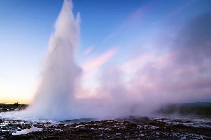 Another view of the majestic Geysir in Iceland. Make sure to dress accordingly! Icelandic weather is as unpredictable as the Geysir itself!