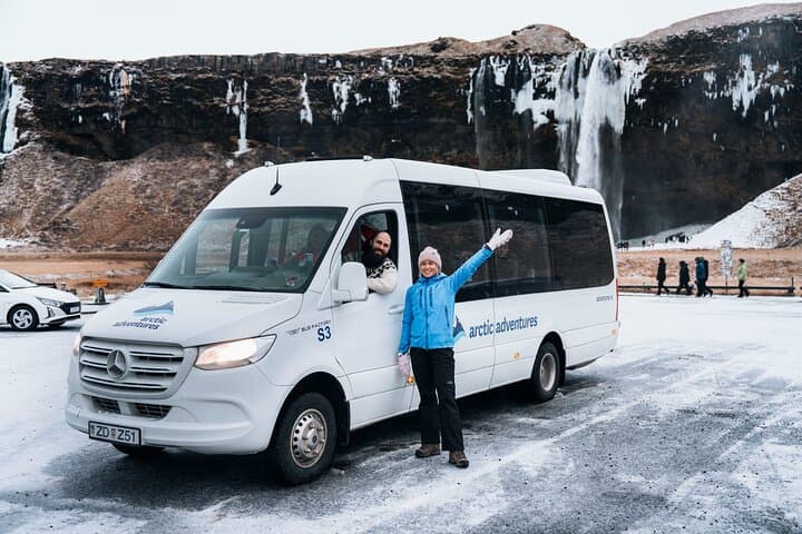 guide and minibus at Seljalandsfoss waterfall